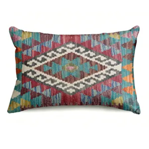 Bohemian style rectangular throw pillow cover featuring vibrant ethnic geometric pattern.