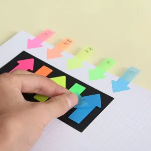 Transparent neon arrow sticky notes closeup, colorful plastic index tabs office.