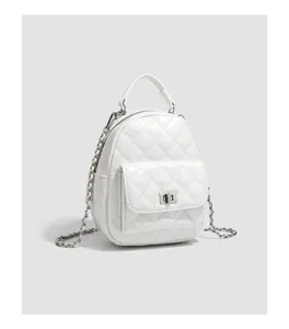 Detailed view of white quilted mini backpack with chic chain strap and secure twist-lock pocket.