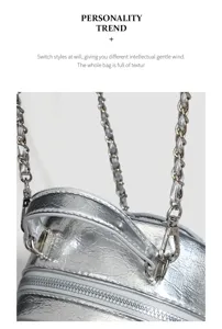 Detailed view of the stylish silver metallic chain backpack featuring premium crinkled texture.