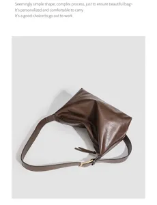 Dark brown leather shoulder bag detail, minimalist work commuting underarm bag design.