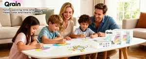 Detail view of family painting together with vibrant dual-tip acrylic markers at home table.