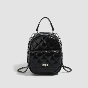 Black quilted mini backpack for women, stylish chain strap shoulder bag with turn-lock.