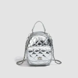 Silver metallic quilted mini backpack with chain straps and chic turn-lock closure design.