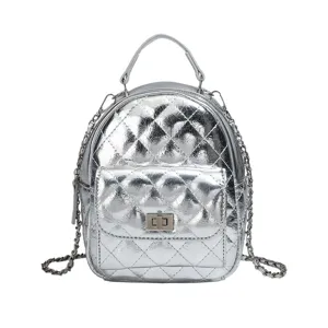 Silver quilted mini backpack for women, stylish metallic chain shoulder bag and travel daypack.