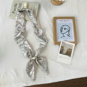 Elegant chic silk skinny scarf with cute bunny pendant and luxury belt print design.