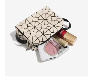 Detail view of the geometric rhombus cosmetic bag showing large capacity and internal storage layout.