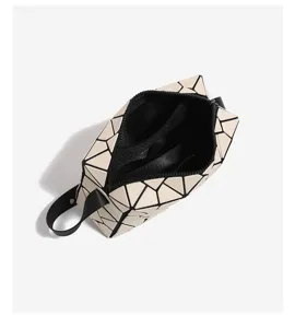 Geometric lattice tote handbag, stylish minimalist commuter casual small square bag.