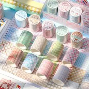 Close-up detail view of retro plaid decorative washi tape rolls for DIY crafts and journaling.