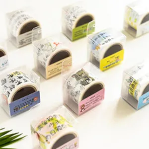 Decorative cartoon washi tape rolls in clear boxes, ideal for DIY scrapbooking and journal crafts.