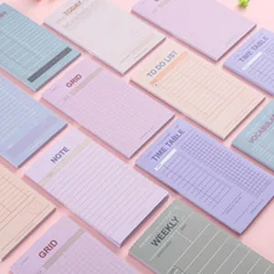 Colorful sticky notes memo pad set, aesthetic pastel student office stationery detail view.