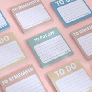 Detailed view of colorful sticky notes with TO DO text, office memo pad flat lay view.