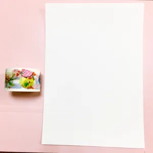 Washi tape roll and release paper step guide for journaling crafts DIY stationary set.