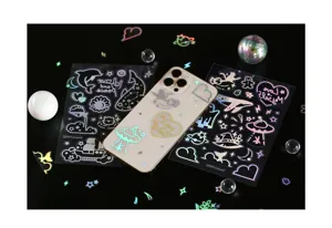 Detailed close-up of holographic transparent cartoon stickers, ideal for DIY phone decor.