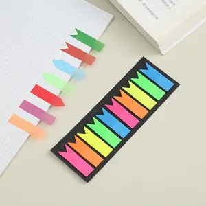 Translucent fluorescent sticky notes detail shot, colorful arrow index tabs for study.