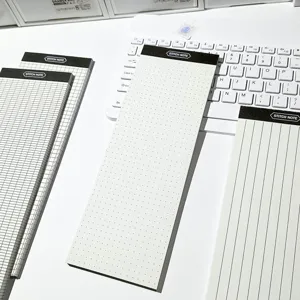 Detailed view of long tear-off notepad with dot grid and lines, perfect for daily notes.