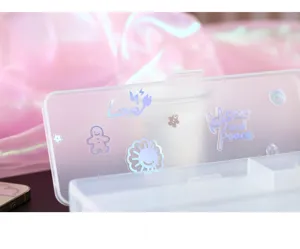 Clear plastic storage box featuring cute holographic cartoon stickers for daily organization use.