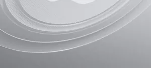 Close-up detail shot of the minimalist metal pen body showing fine texture and sleek curved layers.