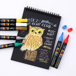 GuangNa colorful oil-based paint marker pens set with black sketchbook for art drawing graffiti.