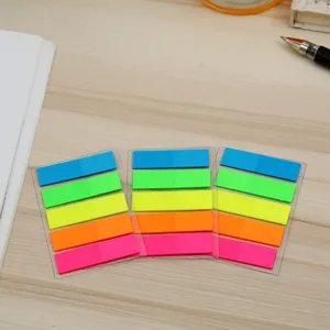 Colorful PET sticky index tabs, transparent base neon sticky notes detail closeup view.