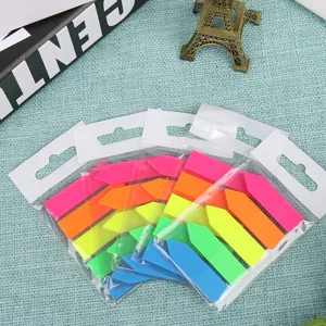 Close up of colorful PET fluorescent arrow index sticky notes in transparent packaging.
