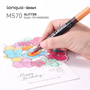 Detail shot of Lanquo dual-tip glitter marker pen writing on decorative greeting card for art.