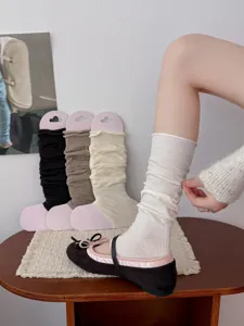 Ballet style long stirrup leg warmers for women, cozy loose cuff slouch socks for autumn wear.