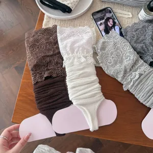 Detailed view of sweet Lolita lace stirrup leg warmers, featuring delicate ruffles and soft knit.