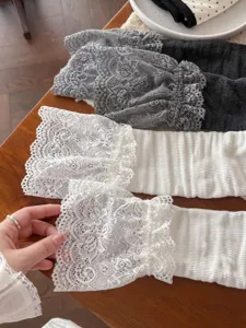 Detailed view of women lace leg warmers sweet lolita stacked socks cuff texture