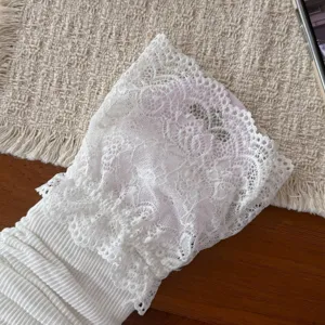 White lace leg warmers sweet Lolita stirrup socks cute ruffled knit boot cuffs detail view