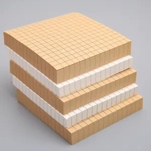 Square grid sticky notes memo pads, kraft brown and white paper sheets for school office.