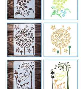 Detailed view of hollow painting stencils showing various floral and tree patterns for DIY crafts.
