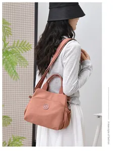 Casual nylon shoulder bag for women, large capacity stylish tote for daily commute and travel.