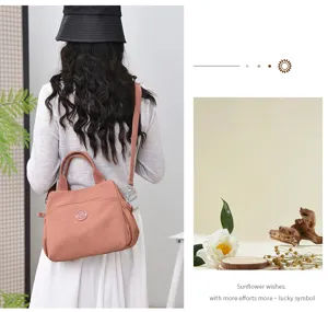 Detail view of the stylish casual nylon shoulder bag with comfortable handles and strap.