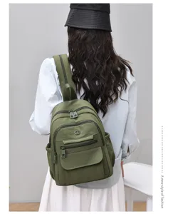 Lightweight nylon backpack for women, large capacity casual travel bag, versatile minimalist design.