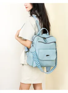 Women's soft leather backpack with ethnic wide strap, stylish blue casual daypack.