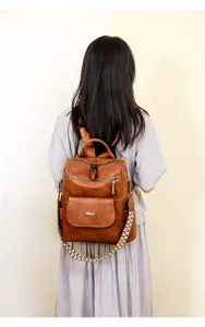 Detail shot showcasing the back wear effect of the vintage soft leather women backpack.