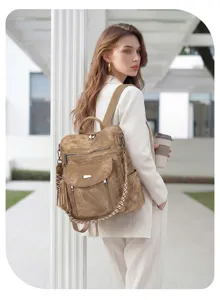 Detailed lifestyle view of vintage brown women backpack in outdoor scene fashion accessory