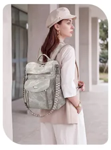 Details of the vintage grey women backpack, featuring multi pockets and stylish wide straps.