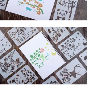Detail view of DIY hollow painting stencils with various animal and plant patterns for craft.
