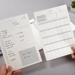 Bloc-notes de planification quotidienne de bureau minimaliste avec calendrier mensuel et blocs de suivi.