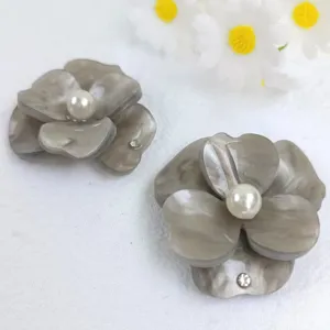 Grey resin flower detail shot with pearl and rhinestone, ideal for DIY hair clip and shoe accessories.