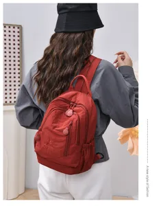 Small lightweight nylon backpack for women casual daily commuter red multi compartment bag stylish