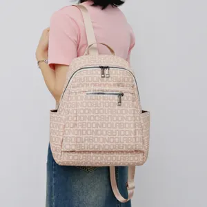 Stylish pink printed backpack for women, casual travel daypack with large capacity detail.