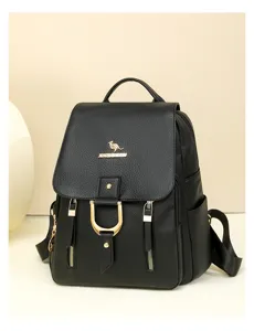 Detailed view of the black soft leather backpack featuring elegant gold-tone hardware accents.