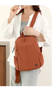 Casual nylon backpack for women, lightweight large capacity travel bag for daily commute.