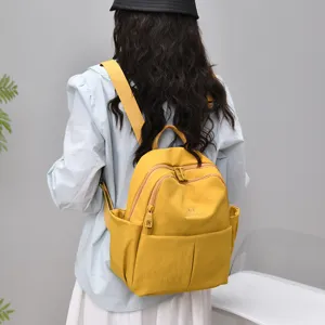 Stylish women's casual yellow backpack, large capacity water-resistant travel school bag.