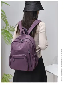 Waterproof nylon backpack for women, casual travel school bookbag with multi pockets purple.