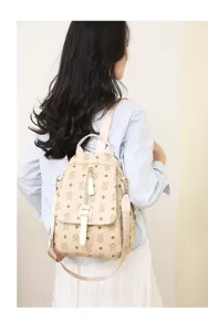 Detailed back view of the chic beige rabbit monogram leather backpack with straps.