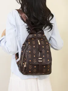 Women vintage brown leather backpack, chic monogram print school bag for daily commuting.